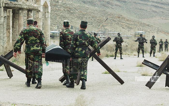 © Davit Hakobyan - Armenian military carrying the corpses of Azeri wreckers © PanARMENIAN Photo 