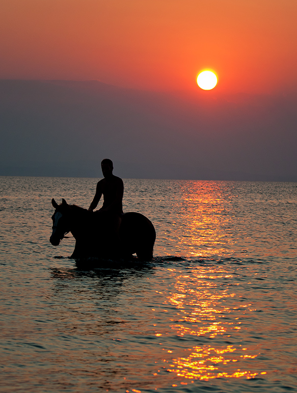 © KYRIAKOS STAVROU - Swimming in the sunset
